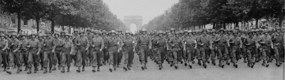 American troops of the 28th Infantry Division march down the Champs Elysees.