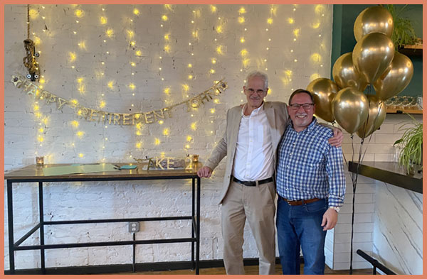 John Brooke and Department Chair, Scott Levi, at his retirement party.