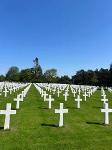 rows of white crosses at the Normandy American Military Cemetery