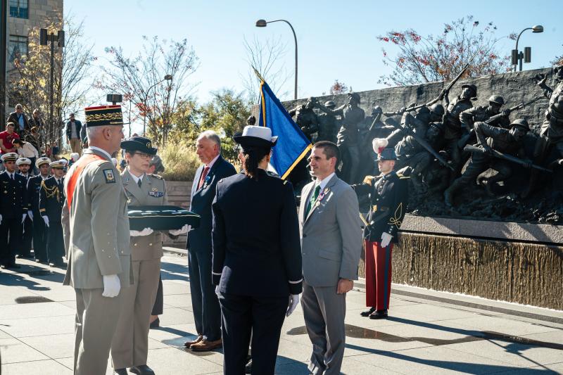 Blazich receiving the award from  French General Francois Lecointre while soldiers look on