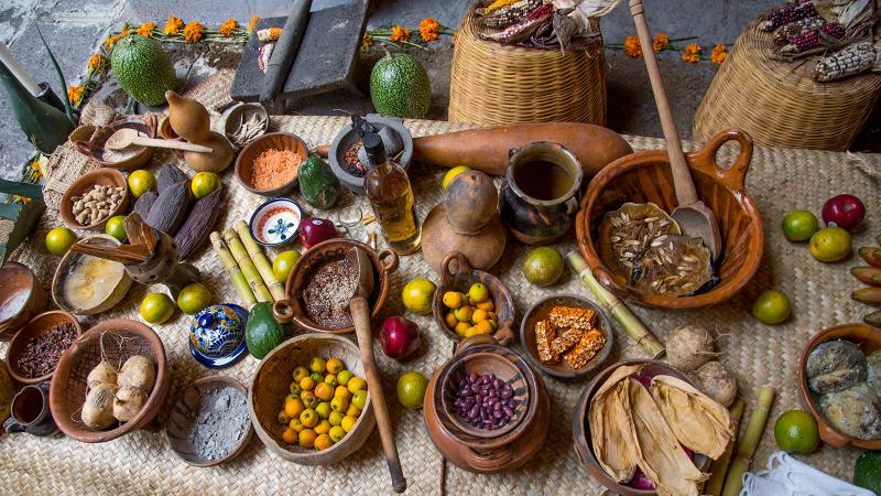 a table with bowls of various foods and grains