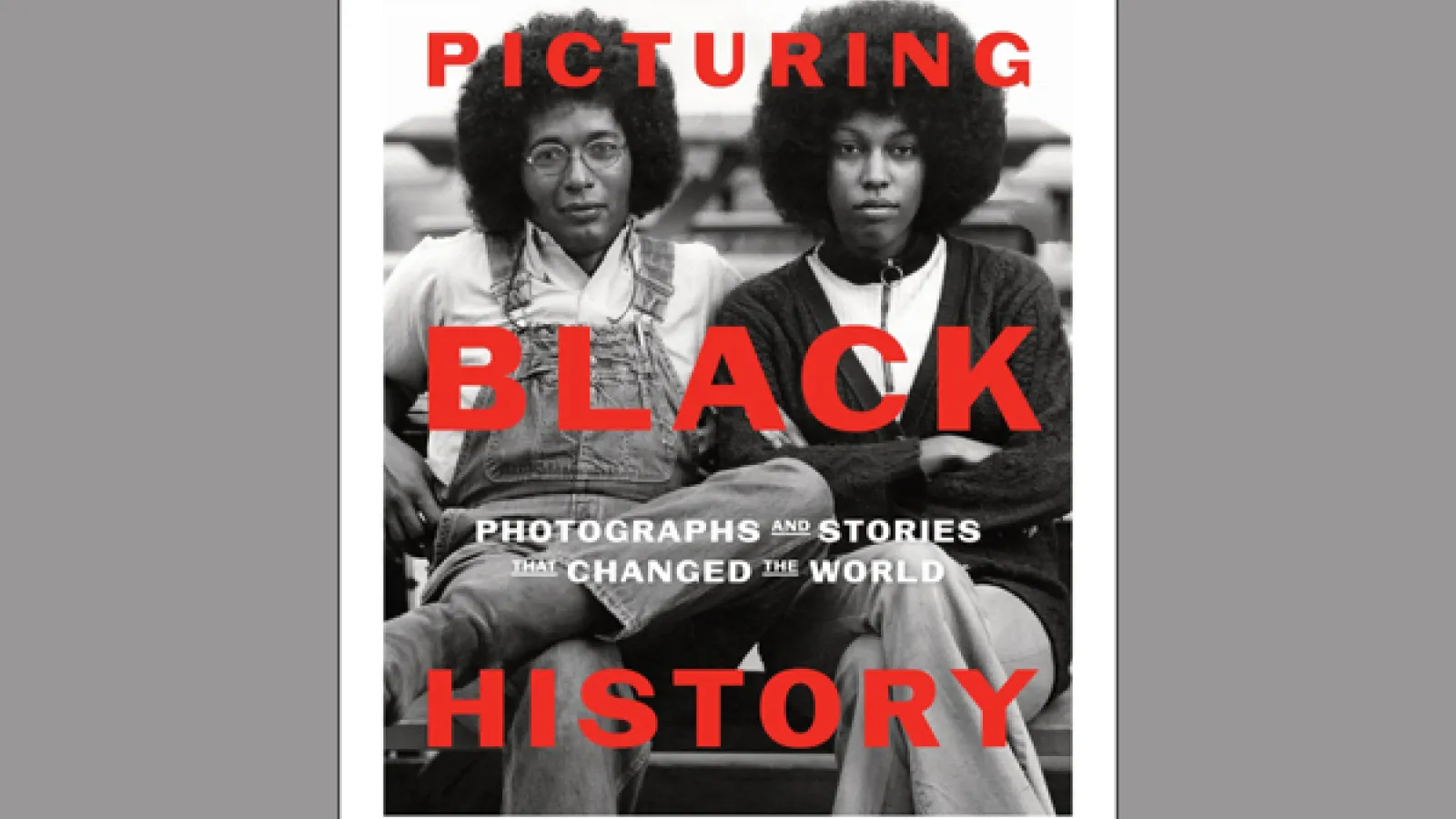 two African Americans sitting on a bench