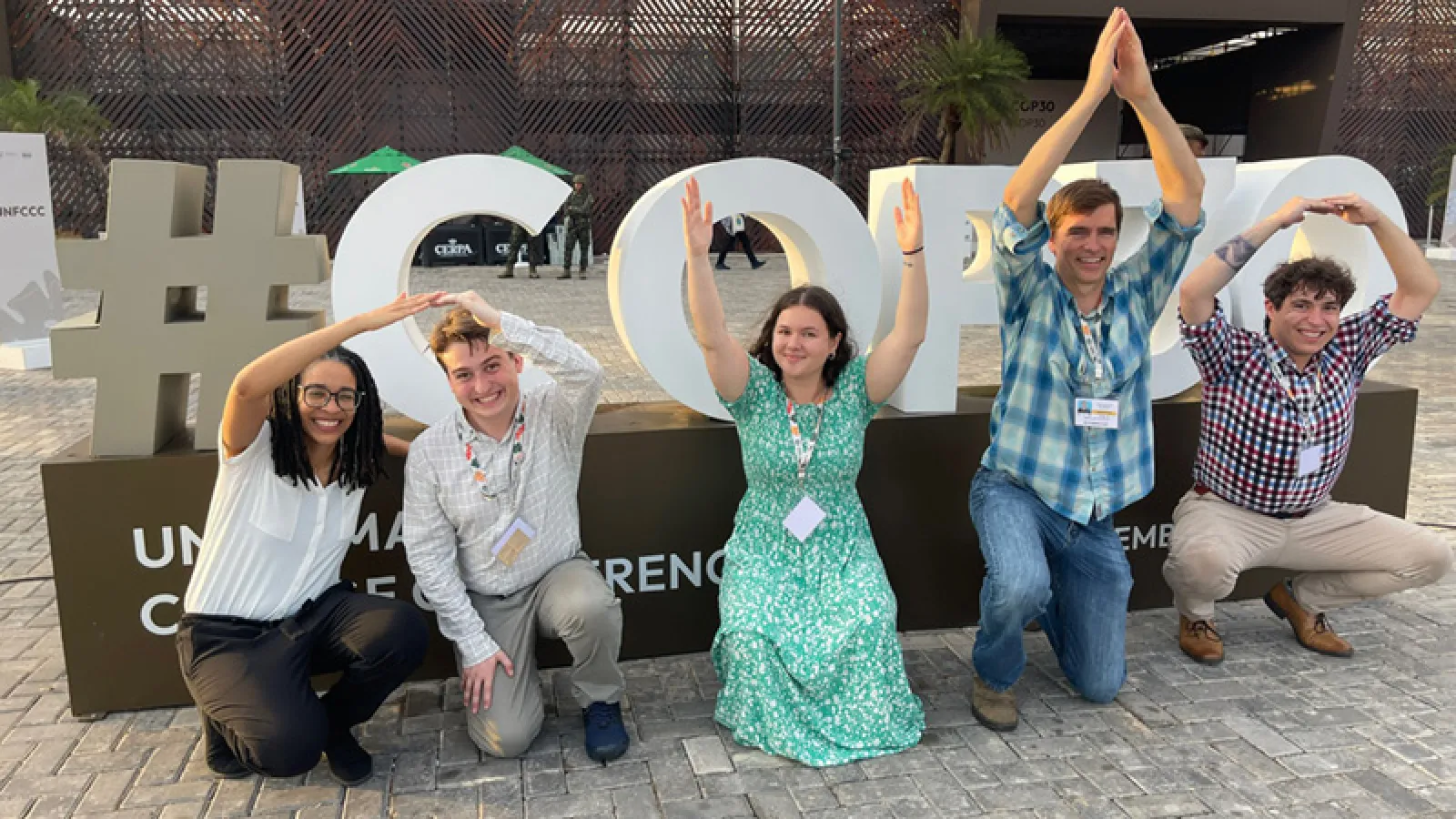 Bart Elmore, Jennifer Eaglin and students form O-H-I-O stance