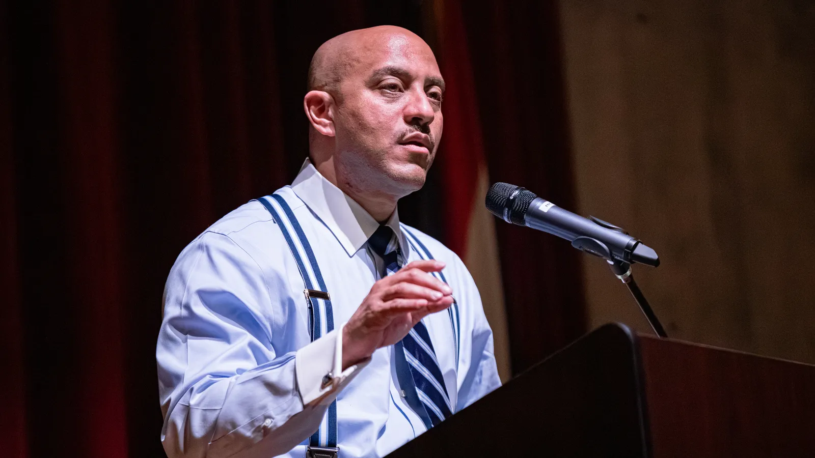 Associate Professor Hasan Jeffries standing at a podium presenting