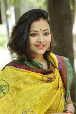 An Indian woman in traditional clothing.