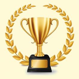 gold trophy with gold leaves around it