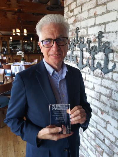 David Staley holding his award