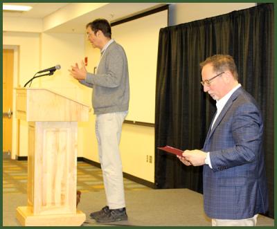 Professor and Undergraduate Enhancement Officer, Randy Roth, announcing Outstanding Research Seminar Essay winners alongside Scott Levi. 