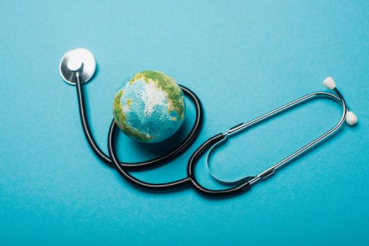 model of a world globe on top of a stethoscope