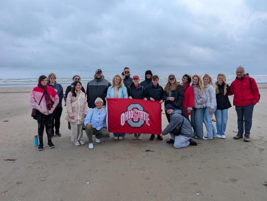 students and faculty on Omaha Beach