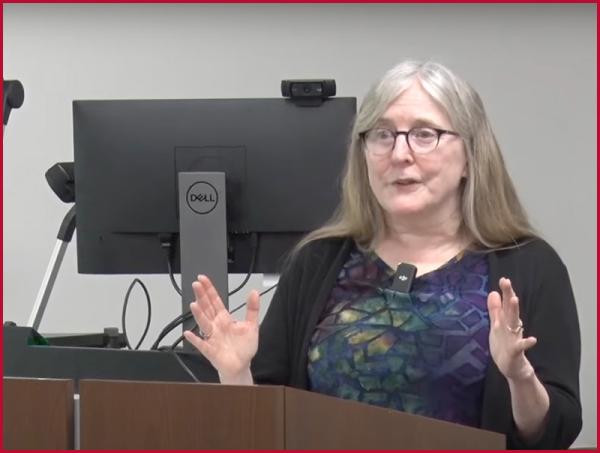 Dorothy Noyes standing at a podium