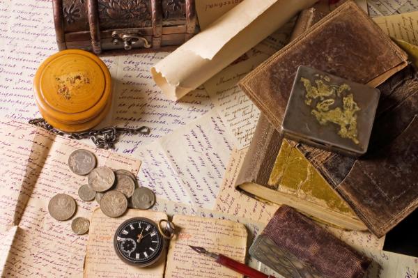 Historic coins, papers and books.