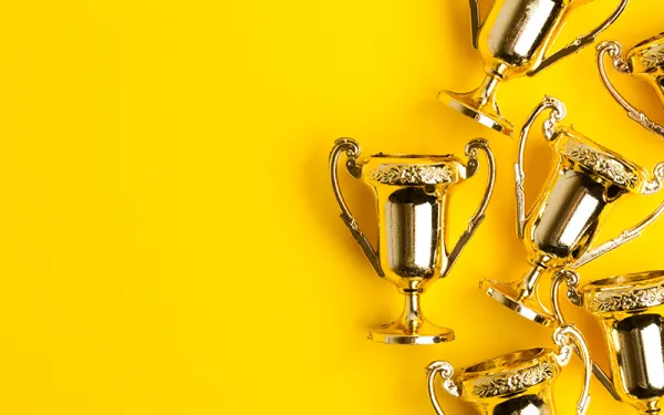awards on a yellow background