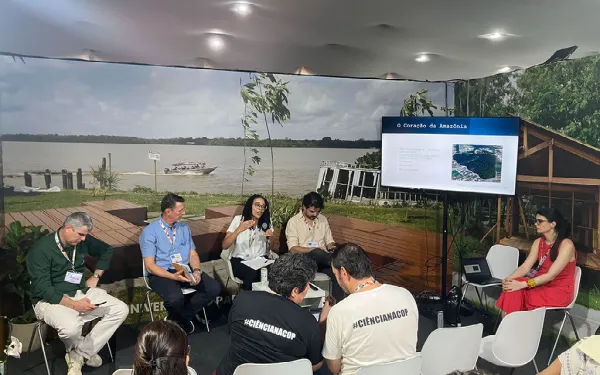 Prof. Jenn Eaglin presenting her research to scholars in Brazil