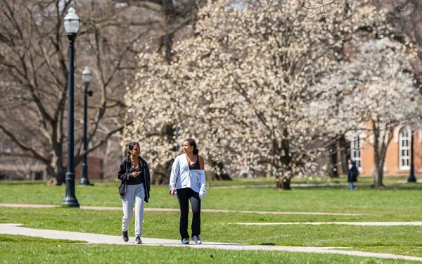 Students walking across The Oval at Ohio State in Spring