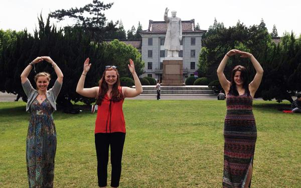 Students in Shanghi posing in O-H-I-O formation