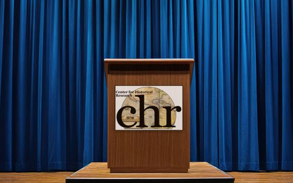 speaker podium with CHR logo on it and a blue curtain behind the podium