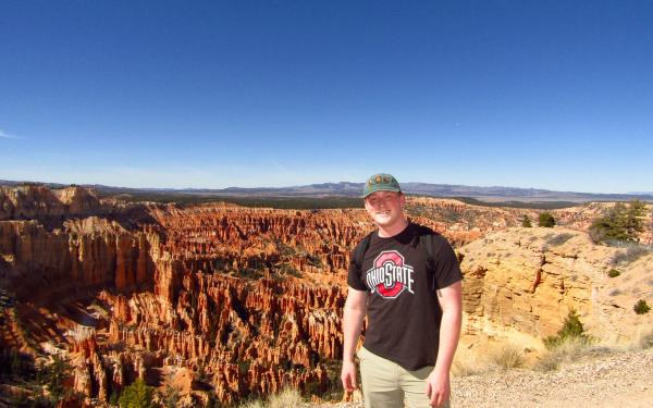 undergraduate student Dylan Burke standing in front of Bryce Canyon