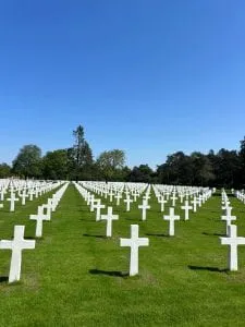 rows of white crosses at the Normandy American Military Cemetery