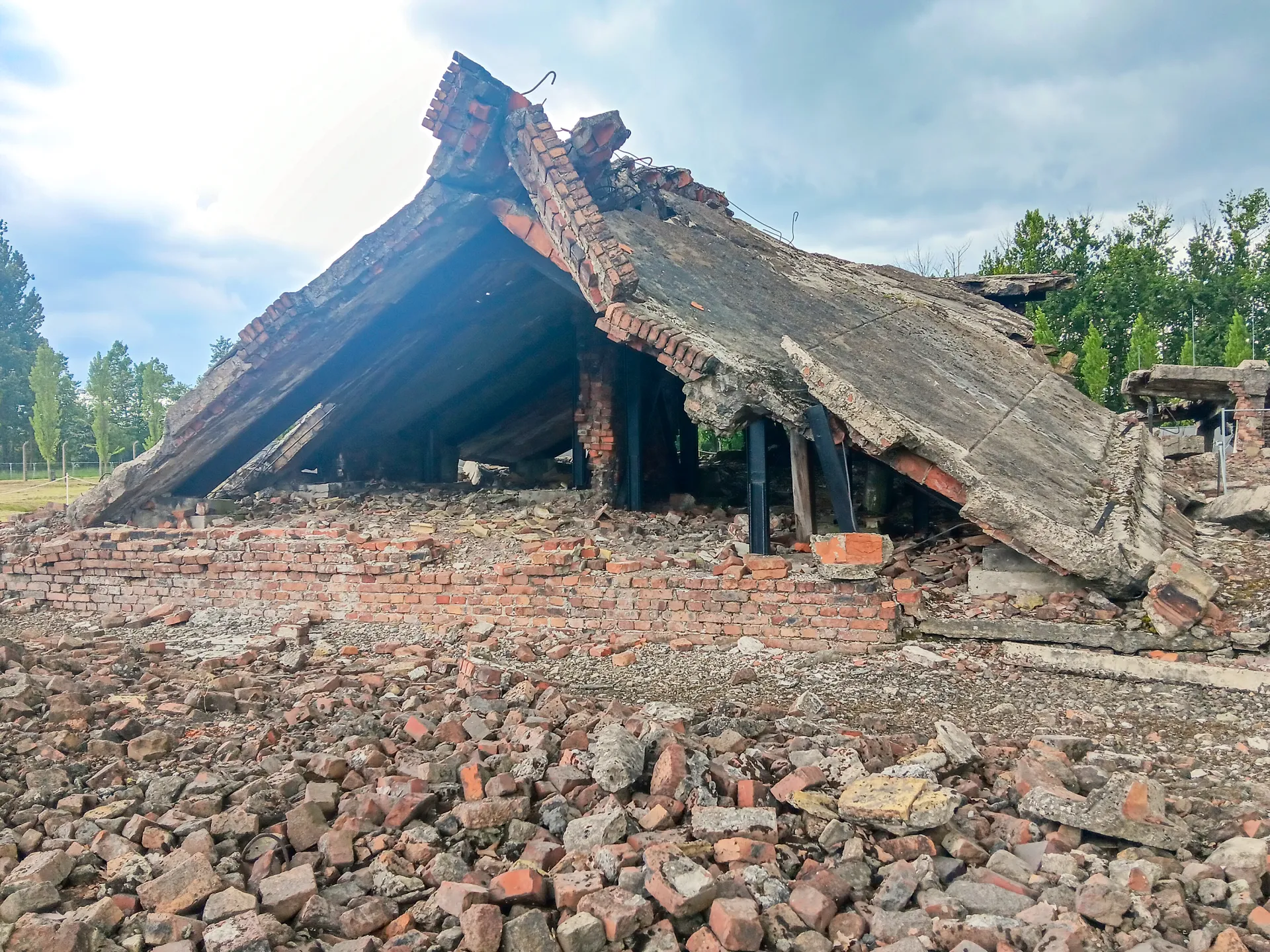 Scattered bricks and broken roof rubble of a collapsed building