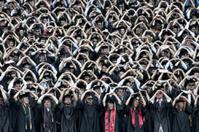 Ohio State students in caps and gowns at graduation ceremony
