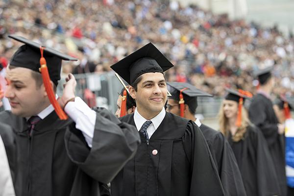 graduates at commencement