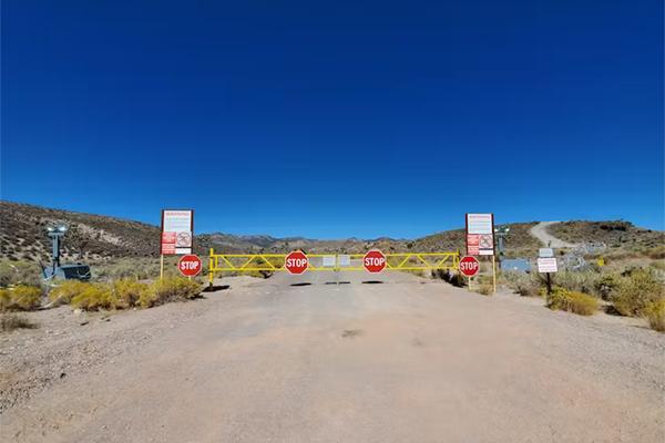 area 51 with a road and signs that say Stop