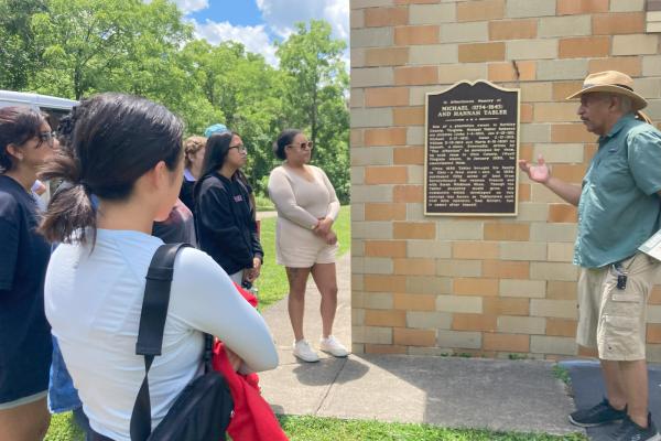 Students listen to David Butcher, a descendant of a formerly enslaved African American community in Ohio.
