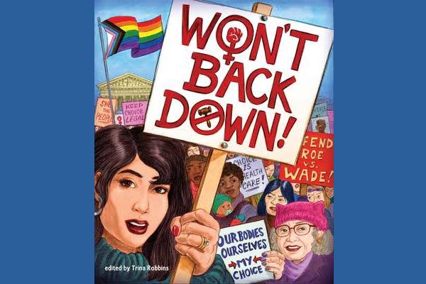 woman holding a sign that reads Won't Back Down!