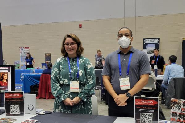Kristin Osborne and Paul McAllister standing behind a table