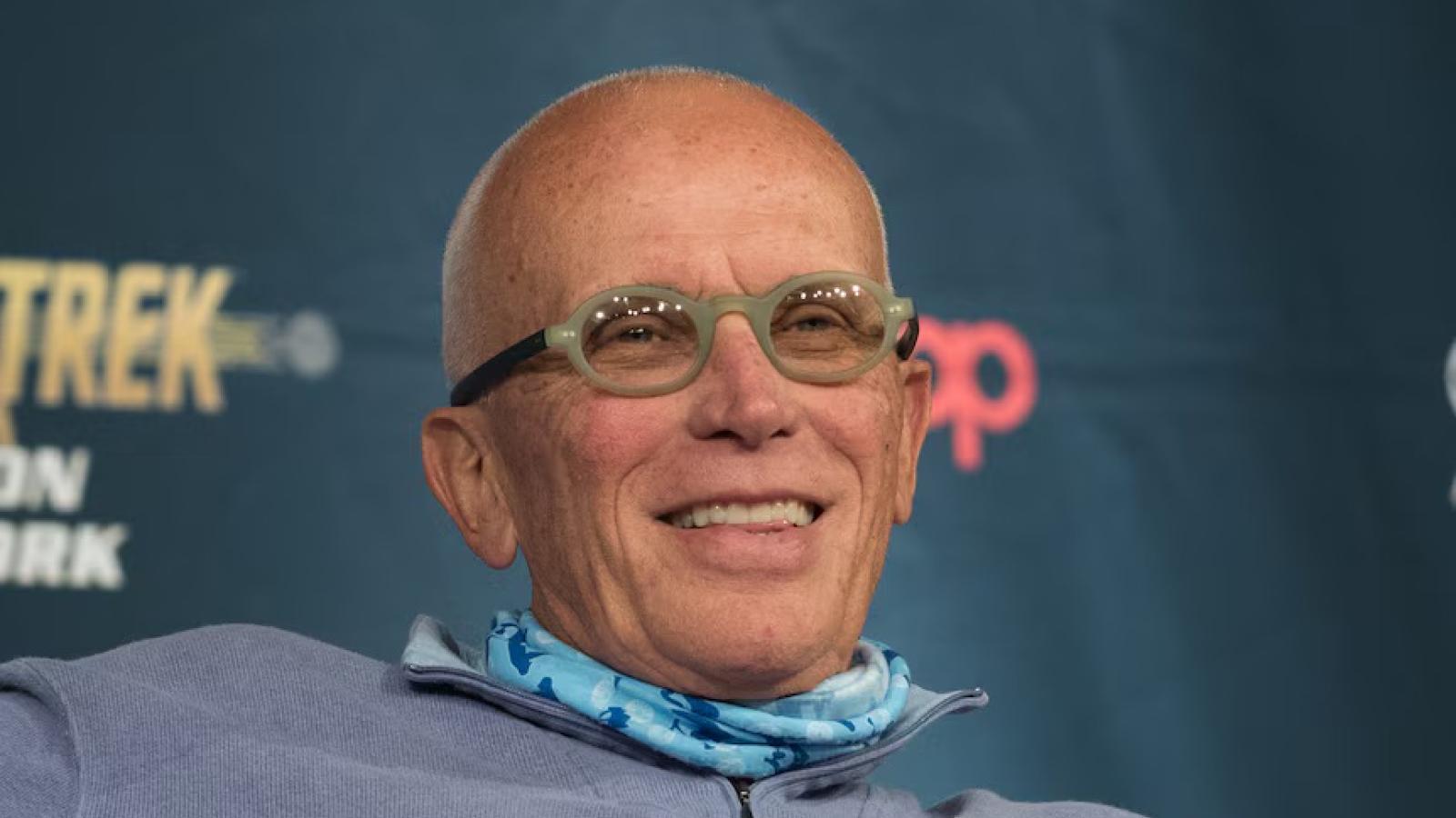 Peter Weller seated smiling