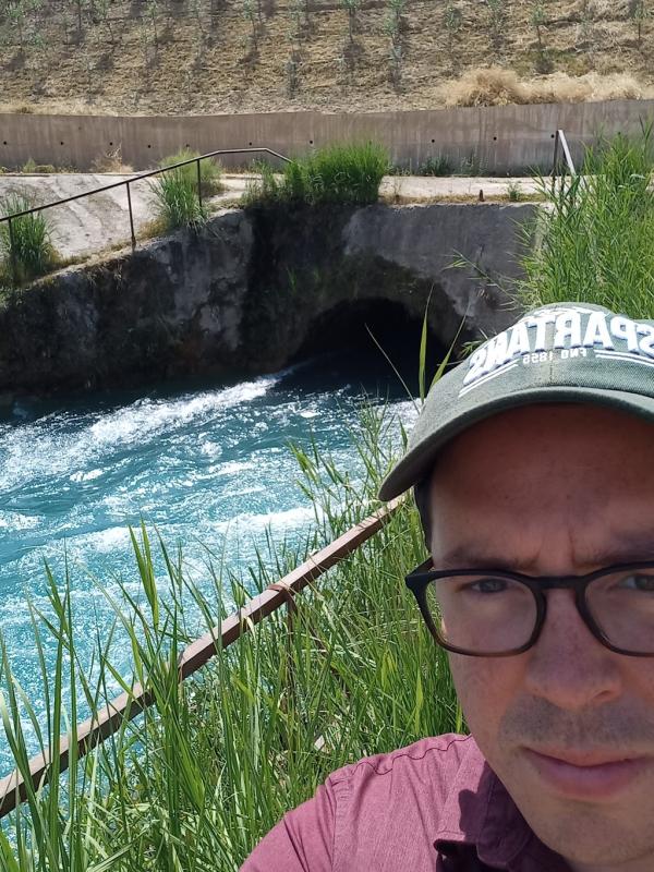 Nicholas Seay at the site of the Yavan-Vakhsh Tunnel in Yovon, Tajikistan. The tunnel was constructed in the 1960s to bring water from the Vakhsh River to the Yovon Valley, which was an important site for cotton cultivation and the development of Integrated Pest Management in Soviet Tajikistan.